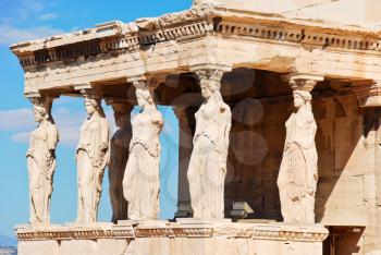 statues of Porch of the karyatides on Acropolis hill, Athens, Greece