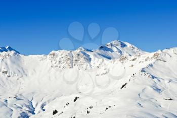 downhill skiing tracks on snow slopes of mountains in Portes du Soleil region, Morzine - Avoriaz, France