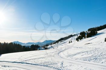 snow road and ski track near Avoriaz town in Alps, Portes du Soleil region, France
