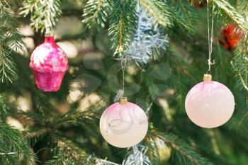 pink balls and house christmas tree vintage decoration close up