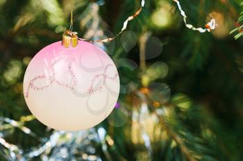pink glass ball christmas tree vintage decoration close up
