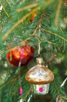 yellow glass home and red ball christmas tree vintage decoration close up