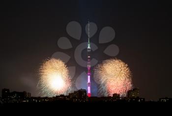 Night view of Moscow city with Ostankino TV Tower and fireworks