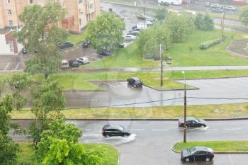 above view of urban street in pouring rain in summer day