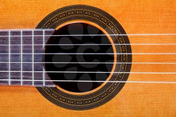 sound hole with rosette inlay of classical acoustic guitar close up