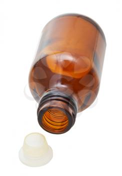empty amber glass little pharmacy bottle with caps isolated on white background