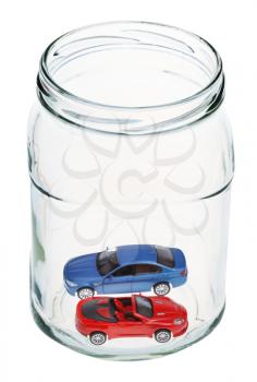two new cars in open glass jar
