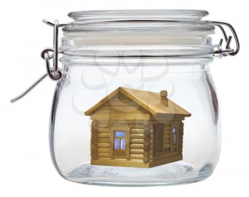 new log house in closed glass jar
