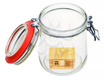 new wooden house in open glass jar