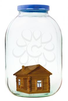 rural wooden house in closed glass jar