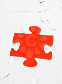 red puzzle piece on layer assembled puzzles