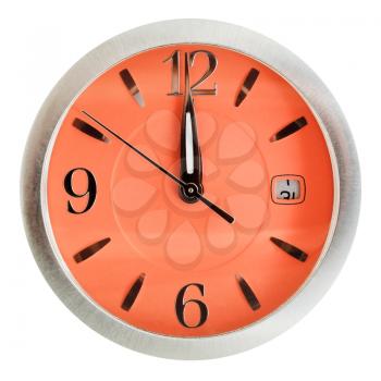 one minute to twelve o'clock on orange dial isolated on white background