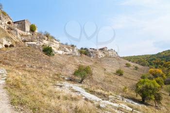 Walls of ancient town chufut-kale on mountain in Crimea