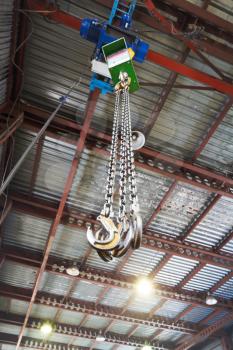 hooks of weigher bridge crane in hangar warehouse