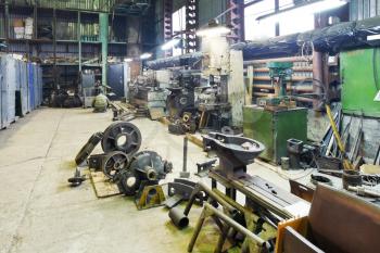 turnery mechanical workshop with lathes and parts of disassembled motor