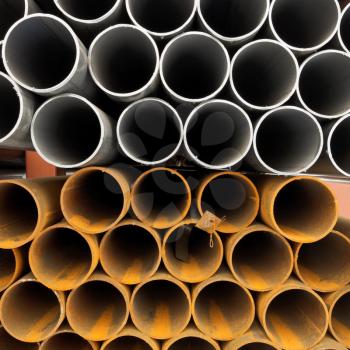 tops of construction pipes close up on outdoor warehouse in winter