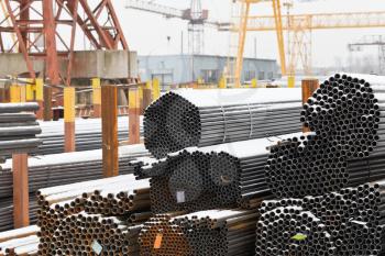 storage of steel pipes in outdoor warehouse with gantry cranes