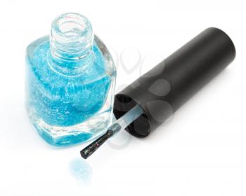 above view of bottle with spilled turquoise nail polish on white background