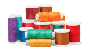 multicolored thread spools isolated on white background