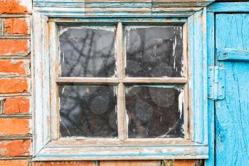 old small shabby window in country shed