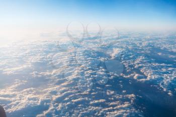 above view of clouds and horizon from airplane