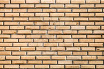 background from of yellow facing bricks wall