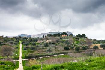 Morgantina settlement under rainy clouds in spring, Sicily, Italy