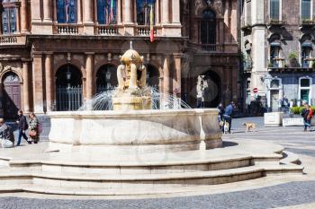 CATANIA, ITALY - APRIL 5, 2015: theater and fountain on Piazza Vincenzo Bellini in Catania, Sicily, Italy. Teatro Massimo Bellini is an opera house, it was inaugurated on 31 May 1890.