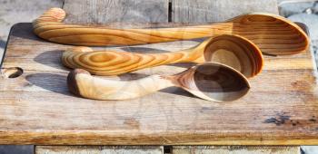 traditional russian carved wooden spoons on cutting board