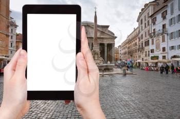 travel concept - tourist photograph Pantheon from Piazza della Rotonda in Rome, Italy on tablet pc with cut out screen with blank place for advertising logo