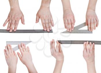 set of hands with metallic rullers isolated on white background
