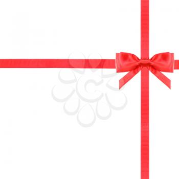 one red satin bow in upper right corner and two intersecting ribbons isolated on square white background