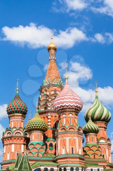 Pokrovsky cathedral on Red Square in Moscow and blue sky with white clouds in sunny summer day