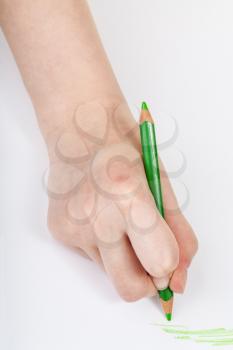 hand draws by green crayon on sheet of paper isolated on white background