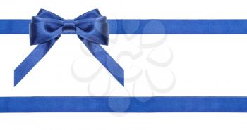 one blue satin bow in upper left corner and two horizontal ribbons isolated on horizontal white background