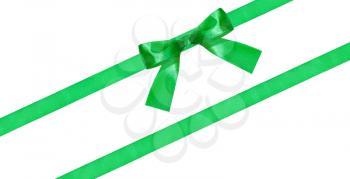green bow knot on two diagonal silk bands isolated on white background