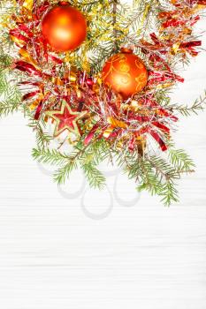 Christmas greeting card - border from star and golden Xmas decorations and tree branch on blank paper background