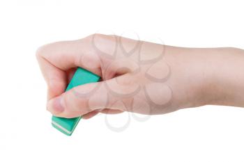 hand with green rubber eraser close up isolated on white background