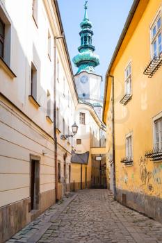 travel to Bratislava city - narrow Bastova street and Michael's Gate tower in Bratislava