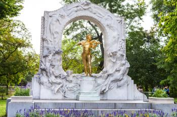 travel to Vienna city - front view of gilded bronze monument of Waltz King Johann Strauss son in Stadtpark (City Park) Vienna, Austria