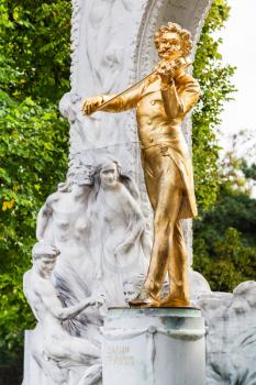 travel to Vienna city - golden statue Waltz King Johann Strauss son in Stadtpark (City Park) Vienna, Austria