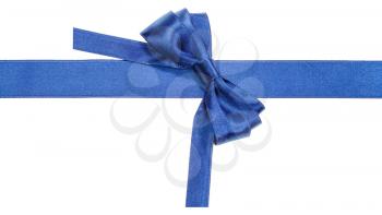 Turned real blue satin bow on narrow ribbon isolated on white background