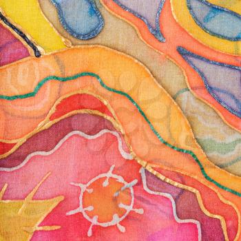textile background - yellow, red, blue abstract hand painted pattern on silk batik