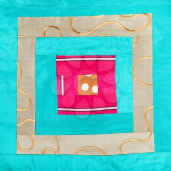 textile background - square decoration of patchwork cloth