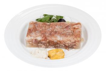 piece of meat aspic with seasonings on white plate isolated on white background
