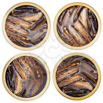 set of canned smoked sprats fish in oil in open tin isolated on white background