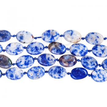 four strings of beads from blue lapis lazuli gem stone isolated on white background
