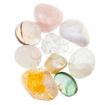 pile of white and transparent natural mineral gemstones isolated on white background