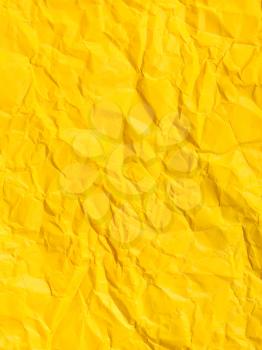 vertical background from yellow colour crumpled paper