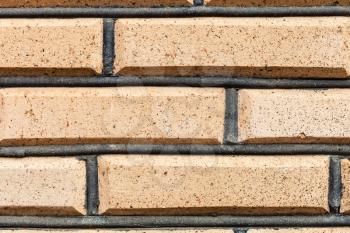 textured background - yellow bricks in wall close up
